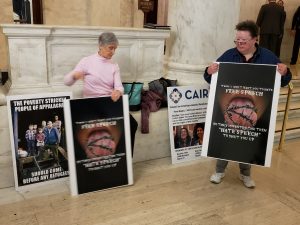 Woman whose poster display sparked controversy returns to Capitol